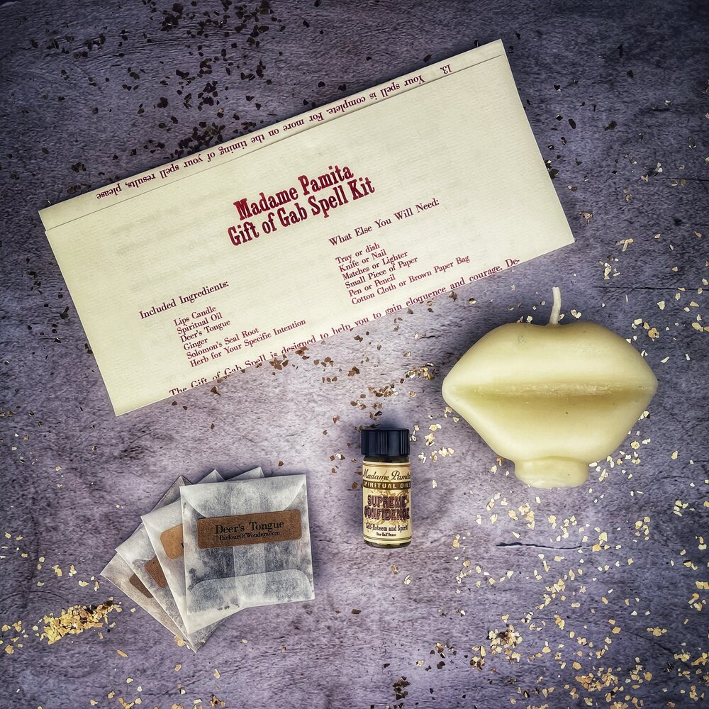 Parlour of Wonders Gift of Gab Candle Spell Kit with purple candles for eloquent speech and powerful communication.