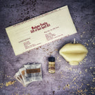 Parlour of Wonders Gift of Gab Candle Spell Kit with purple candles for eloquent speech and powerful communication.