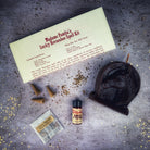 Red Lucky Horseshoe Candle Spell Kit from Parlour of Wonders, featuring candles and charms for luck and power magic.