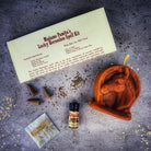 Red Lucky Horseshoe Candle Spell Kit by Parlour of Wonders for luck and power magic, featuring candles and ritual accessories.