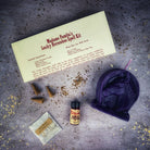 Red Lucky Horseshoe Candle Spell Kit by Parlour of Wonders featuring candles and spell components for luck and power magic.