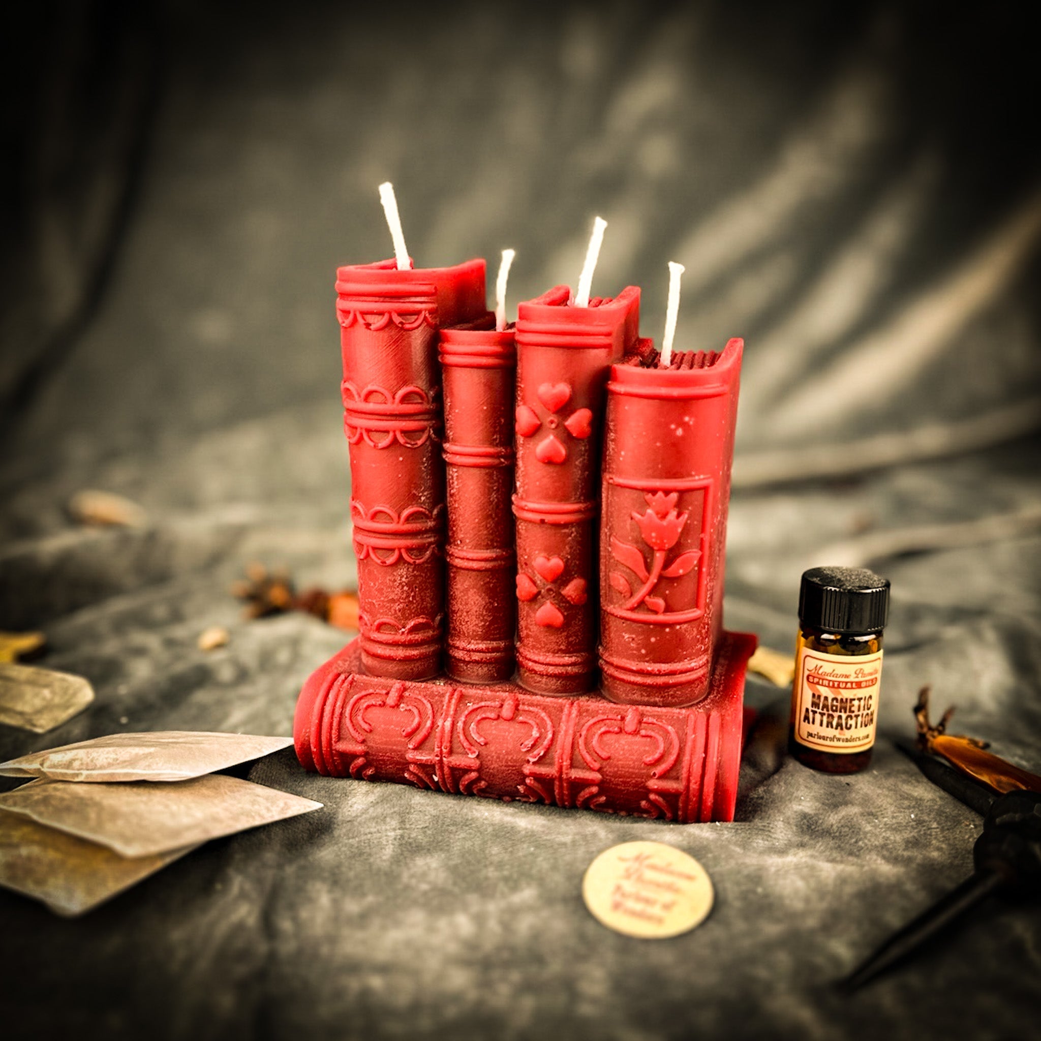 Red Candle Spell Kit for Books of Magic by Parlour of Wonders, featuring candles, spell ingredients, and creative writing tools.