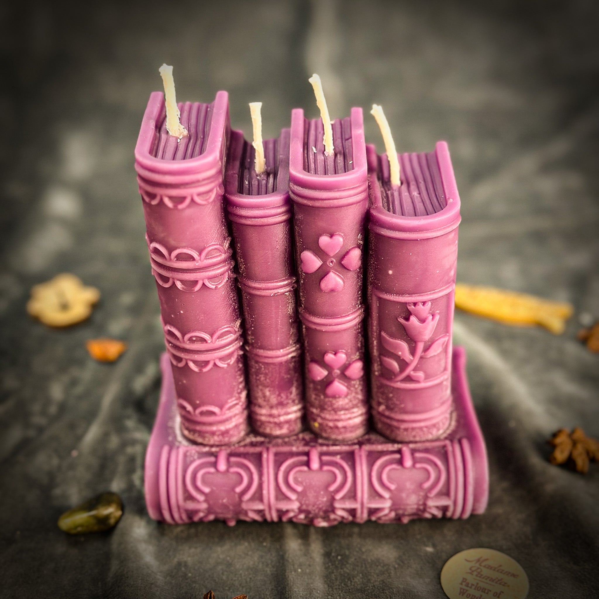 Red Books of Magic Candle Spell Kit by Parlour of Wonders with candles, spell ingredients, and writing tools for magic and creativity.