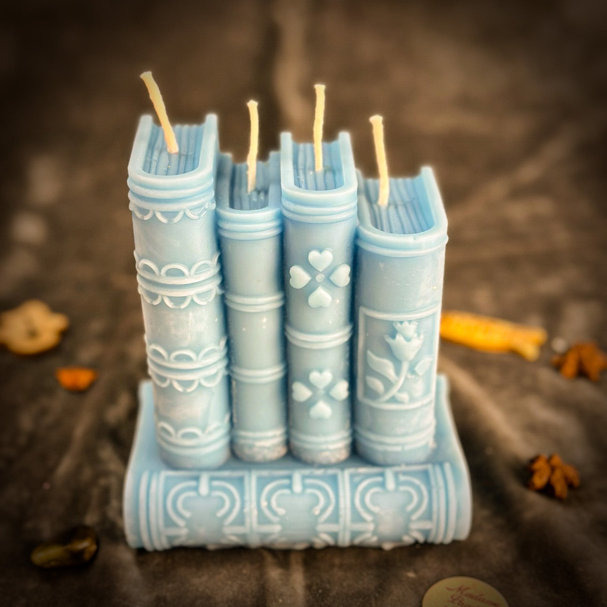 Red Candle Spell Kit from Parlour of Wonders featuring books of magic, candles, and writing supplies for learning and creativity.