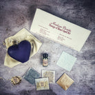 Red candle spell kit from Parlour of Wonders for love reconciliation and emotional healing, with herbs and tools for spiritual practice.