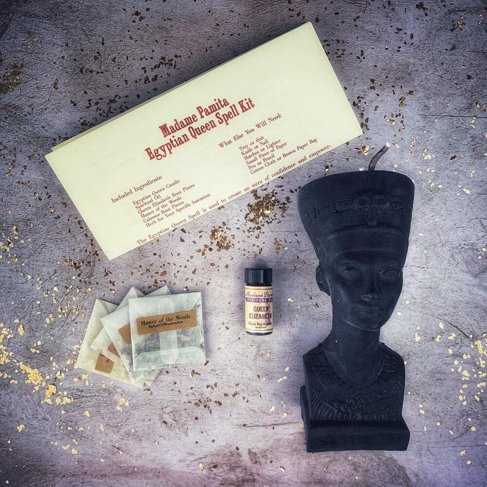 Egyptian Queen Candle Spell Kit by Parlour of Wonders with red candles and magical symbols for power, beauty, and magnetism magic.
