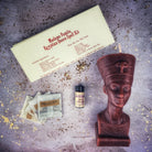 Egyptian Queen Candle Spell Kit by Parlour of Wonders, featuring red candles and ritual tools for power, beauty, and magnetism magic.