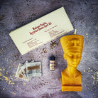 Egyptian Queen Candle Spell Kit by Parlour of Wonders, featuring red candle and magical tools for power, beauty, and magnetism spells.