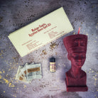 Egyptian Queen Candle Spell Kit by Parlour of Wonders featuring red candles for power, beauty, and magnetism magic.