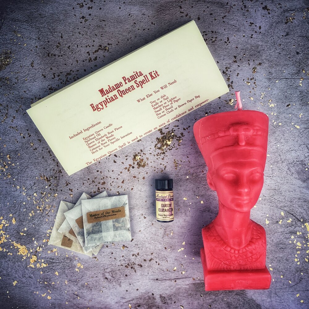Egyptian Queen Candle Spell Kit by Parlour of Wonders with red candles and magical symbols for power, beauty, and magnetism.