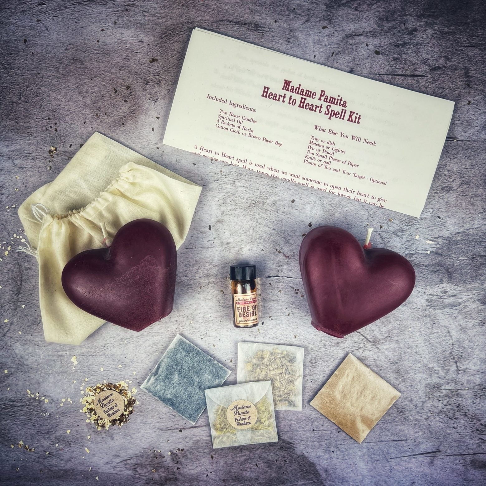 Red Heart to Heart Candle Spell Kit by Parlour of Wonders for love connection and reconciliation magic, featuring candles and spell tools.
