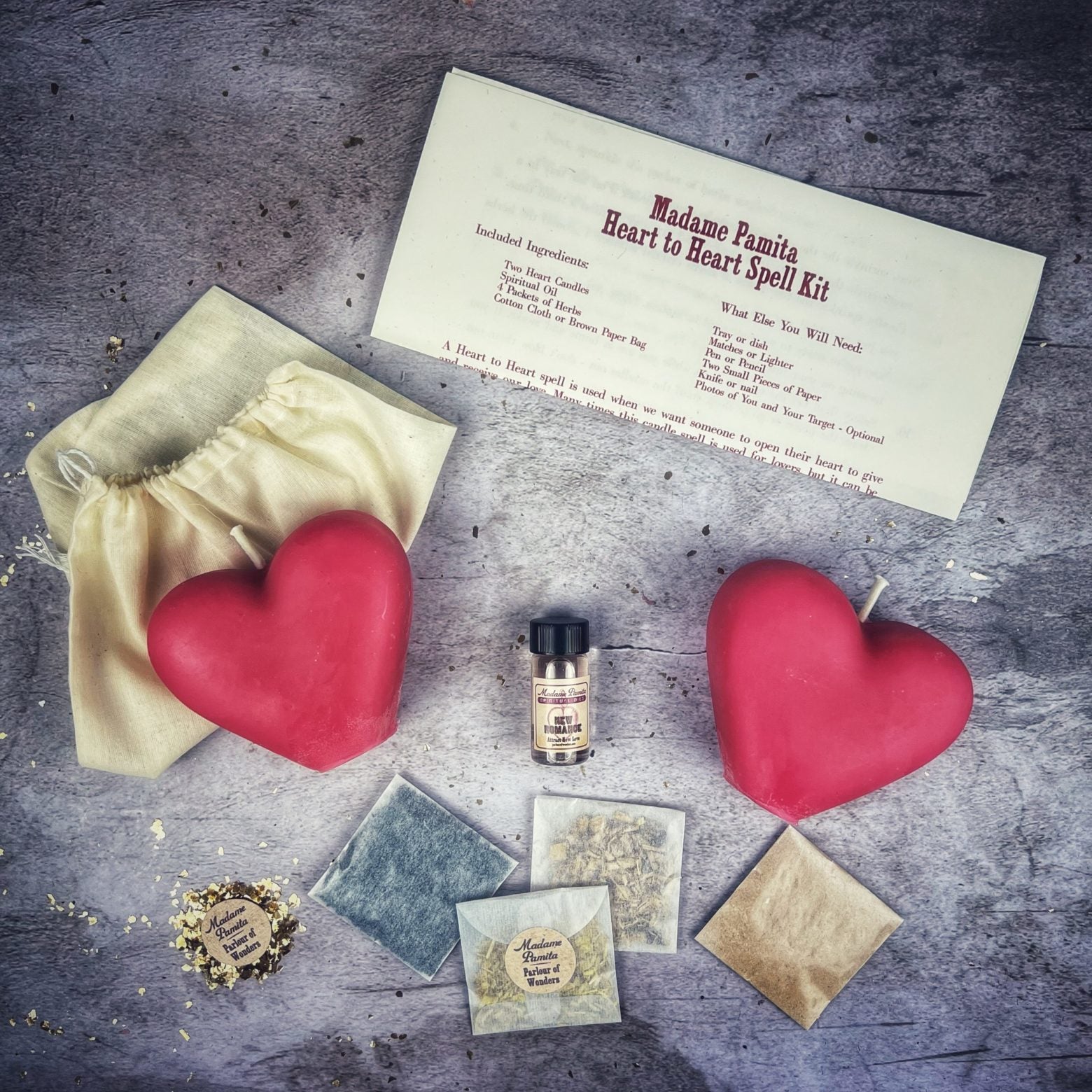 Red Heart to Heart Candle Spell Kit by Parlour of Wonders for love connection and reconciliation magic, featuring candles and spell tools.