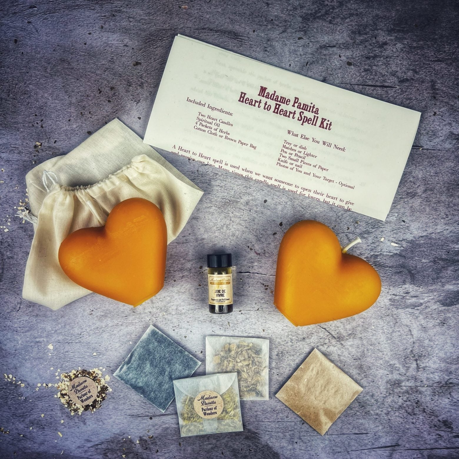 Red Candle Spell Kit with heart design from Parlour of Wonders for love connection and reconciliation magic.