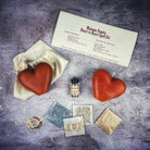Red Heart to Heart Candle Spell Kit by Parlour of Wonders for love connection and reconciliation magic, including candles and ritual tools.
