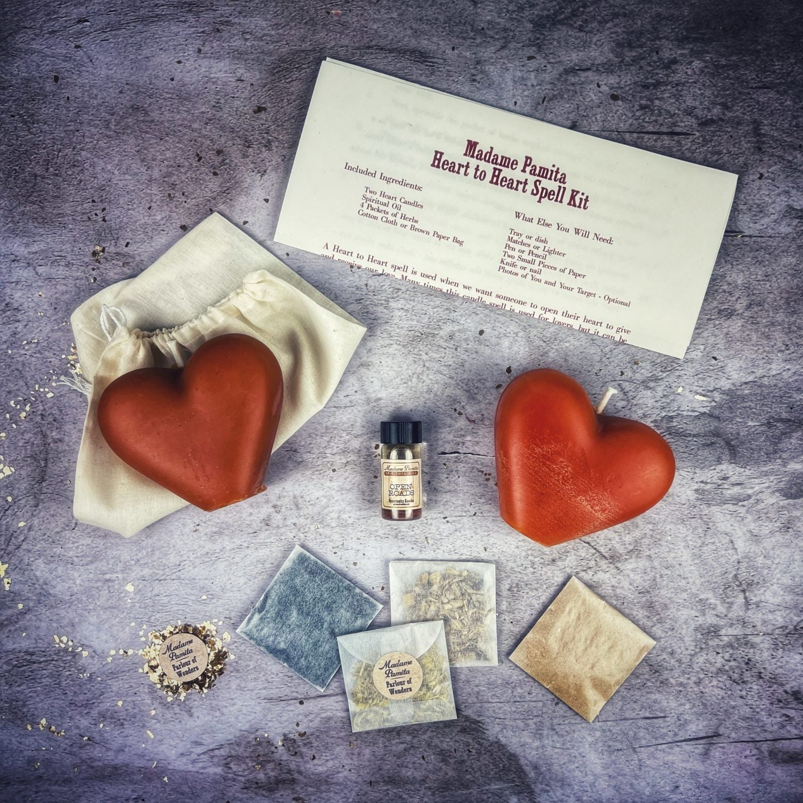 Red Heart to Heart Candle Spell Kit by Parlour of Wonders for love connection and reconciliation magic, including candles and ritual tools.