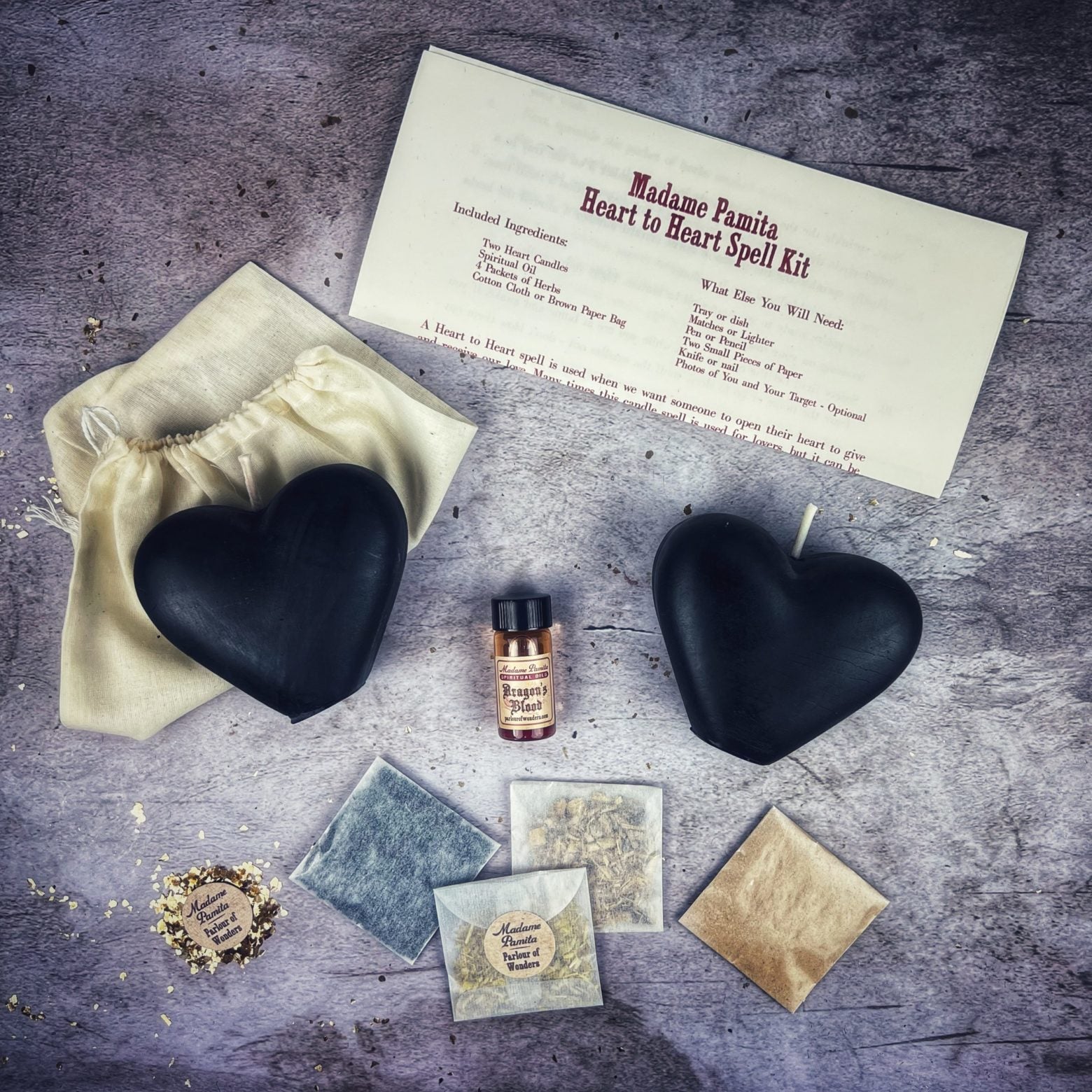 Red Heart to Heart Candle Spell Kit by Parlour of Wonders for love connection and reconciliation magic, with candles and ritual items.