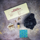 Red Passion Laughing Buddha Candle Spell Kit from Parlour of Wonders for abundance, wealth, luck, and prosperity magic.