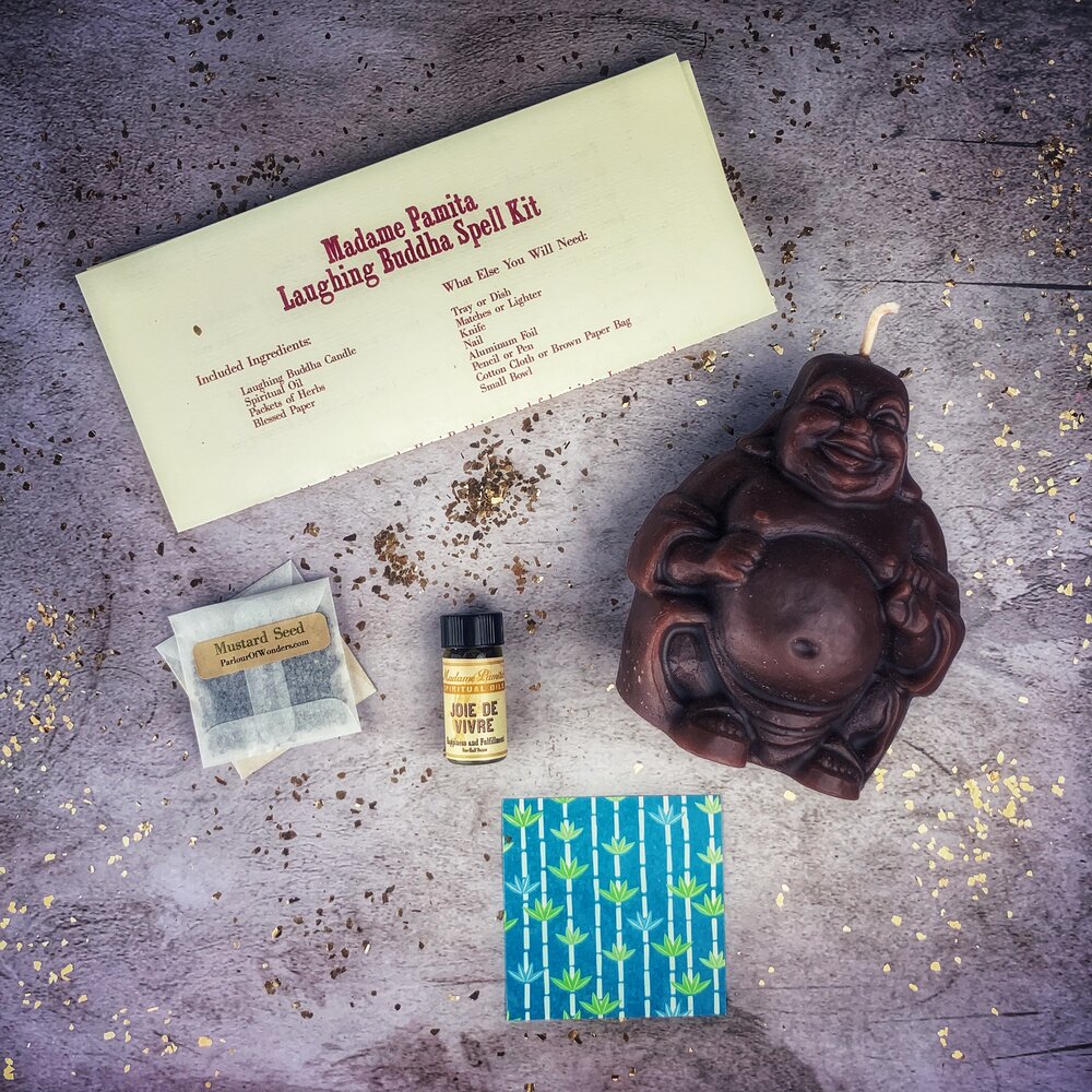 Red Passion Laughing Buddha Candle Spell Kit for abundance, wealth, luck, and prosperity magic by Parlour of Wonders.