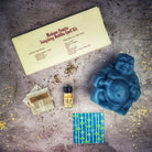 Red Passion Laughing Buddha Candle Spell Kit by Parlour of Wonders for abundance, wealth, luck, and prosperity magic.