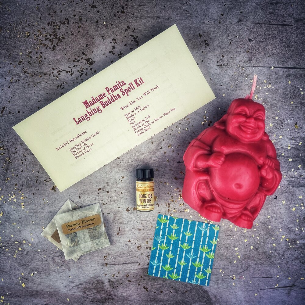 Red Passion Laughing Buddha Candle Spell Kit by Parlour of Wonders for wealth, luck, and prosperity magic.