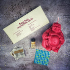 Red Passion Laughing Buddha Candle Spell Kit by Parlour of Wonders for wealth, luck, and prosperity magic.