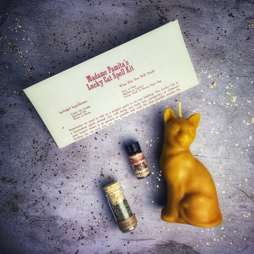 Red Lucky Cat Candle Spell Kit by Parlour of Wonders, featuring candles and tools for manifestation magic and fast action spells.