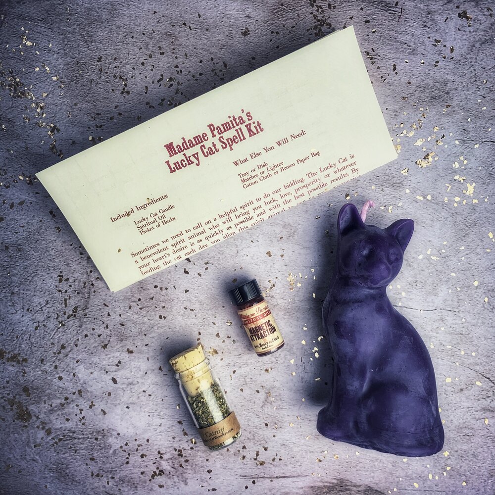 Red Lucky Cat Candle Spell Kit from Parlour of Wonders with candles and spell ingredients for manifestation magic.