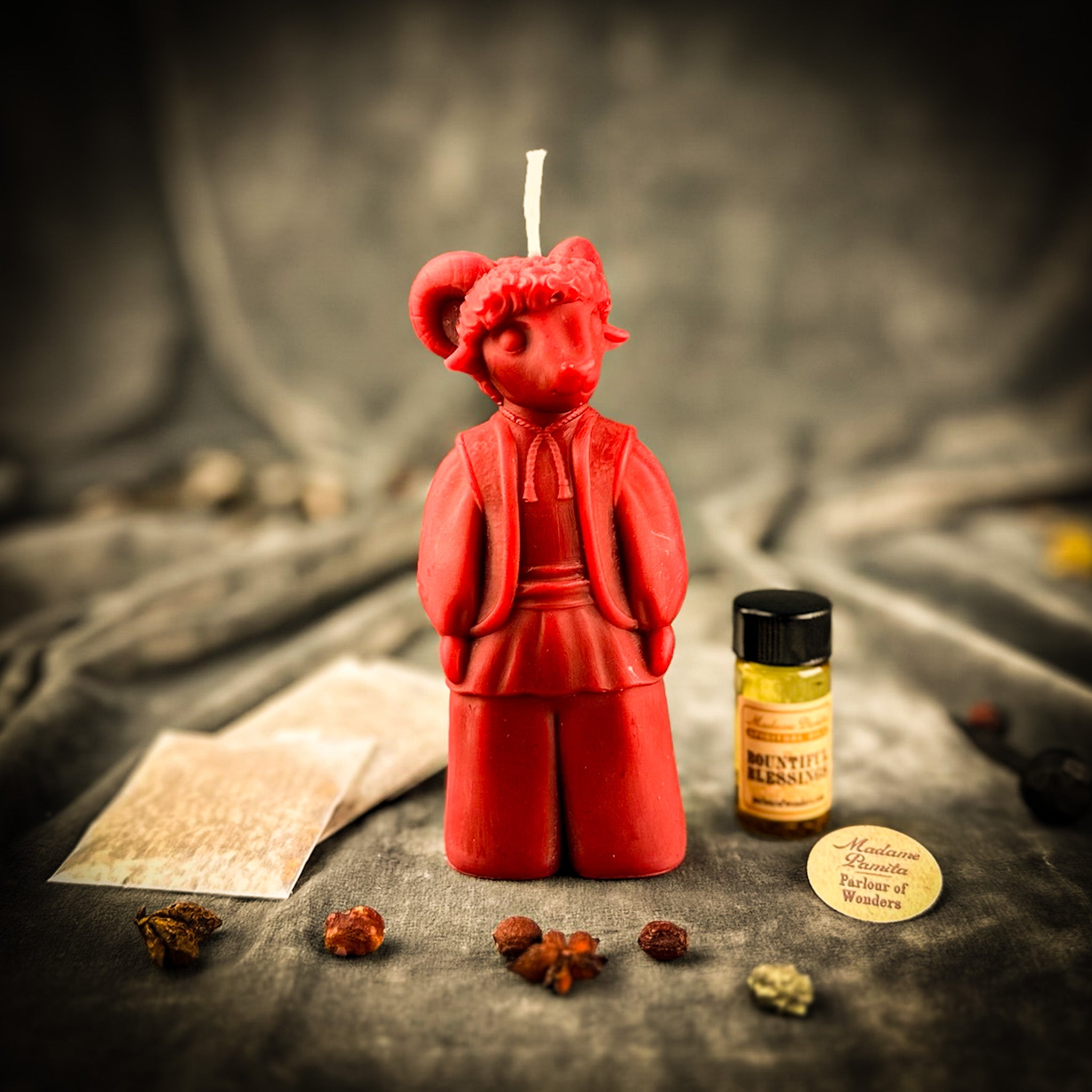 Red Passion New Year Blessing Goat Candle Spell Kit from Parlour of Wonders, featuring candles and ritual tools for spell work.