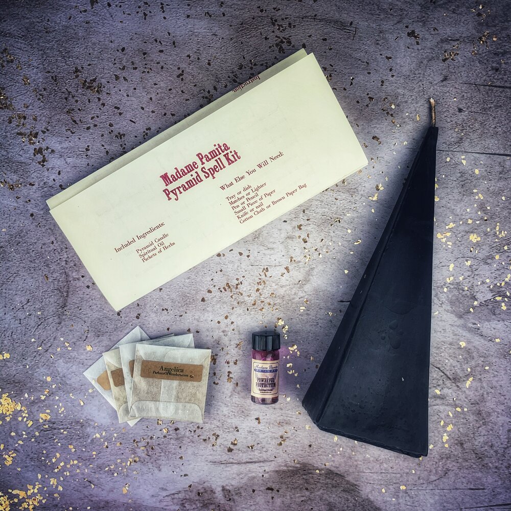 Red Pyramid of Power Candle Spell Kit by Parlour of Wonders with candles and spell components for success and stability.