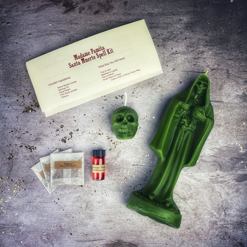 Red Santa Muerte Candle Spell Kit by Parlour of Wonders with candles, herbs, and tools for protection and devotion rituals.