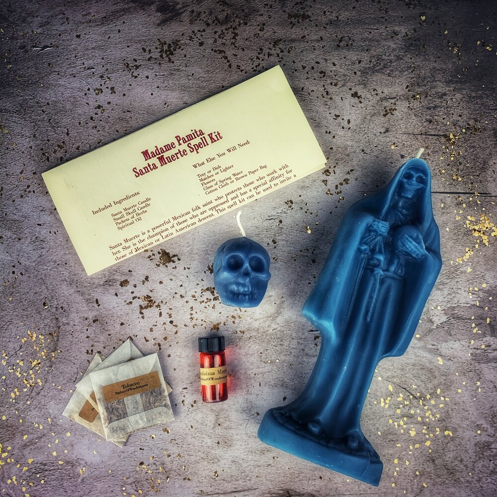 Red Santa Muerte Candle Spell Kit by Parlour of Wonders featuring candles, herbs, and symbols for devotion and protection.