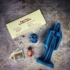 Red Santa Muerte Candle Spell Kit by Parlour of Wonders featuring candles, herbs, and symbols for devotion and protection.