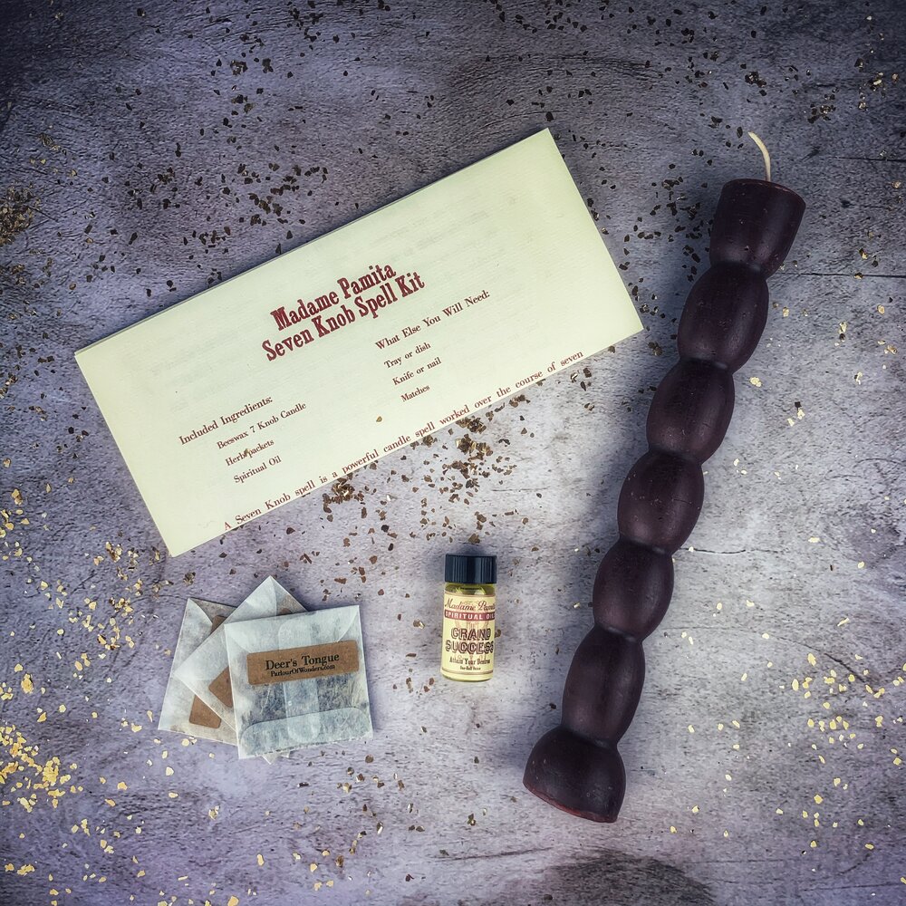 Red Passion Seven Knob Candle Spell Kit for seven-day manifestation magic by Parlour of Wonders, includes candles and ritual tools.