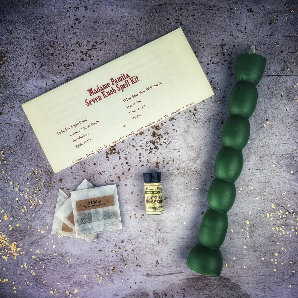 Seven Knob Candle Spell Kit by Parlour of Wonders, featuring red candles for seven-day manifestation magic.