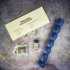 Seven Knob Candle Spell Kit by Parlour of Wonders featuring red candles for seven-day manifestation magic.