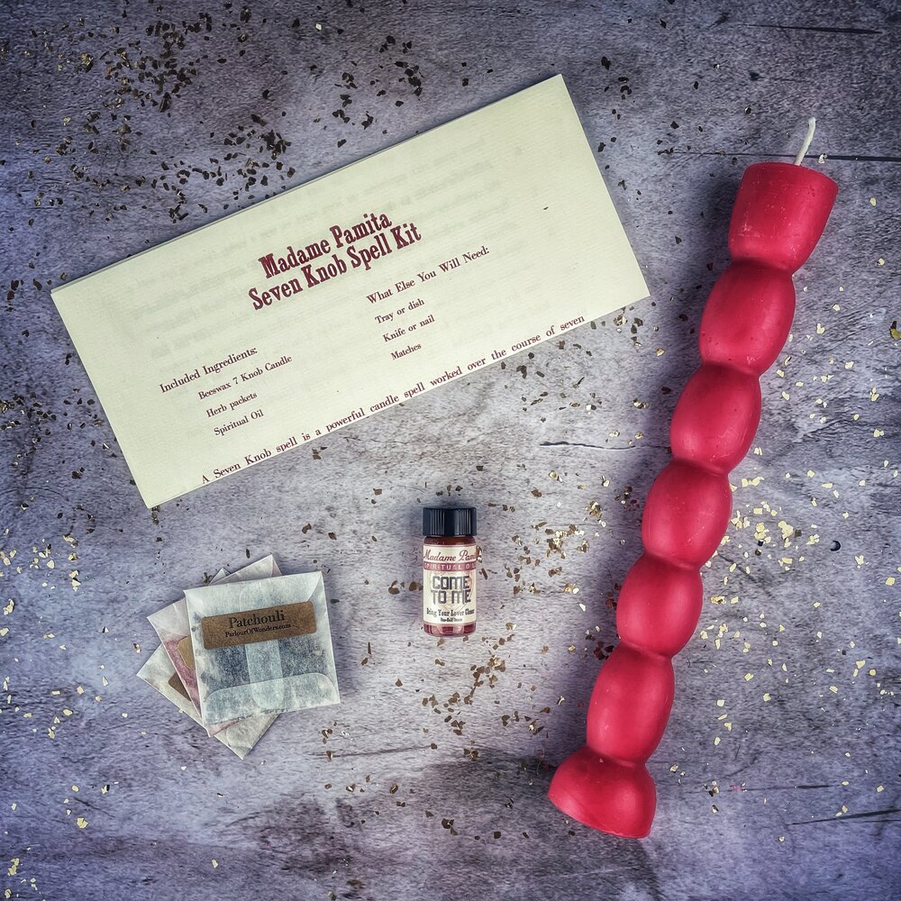 Red Passion Seven-Knob Candle Spell Kit by Parlour of Wonders for seven-day manifestation magic and spiritual rituals.