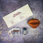 Parlour of Wonders Candle Spell Kit for open communication and reconciliation, featuring red candles and spell tools.