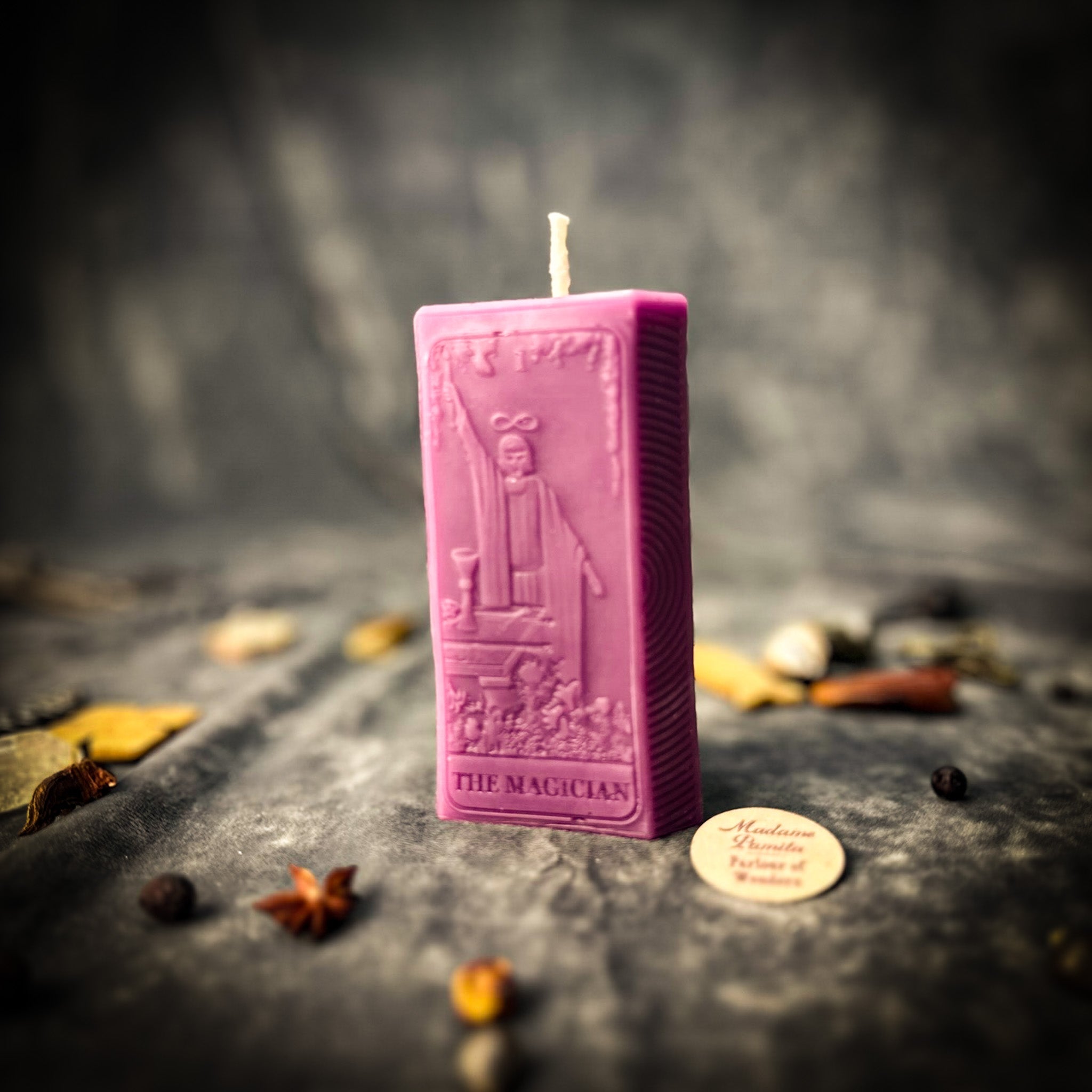 Red Candle Spell Kit from Parlour of Wonders featuring candles for manifestation and willpower magic in a mystical setup.