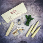 Red Angel Candle Spell Kit by Parlour of Wonders featuring candles and spiritual tools for connecting with spirit guides and divine blessings.