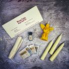 Red Angel Candle Spell Kit by Parlour of Wonders with candles, herbs, and tools for connecting with spirit guides and divine blessings.