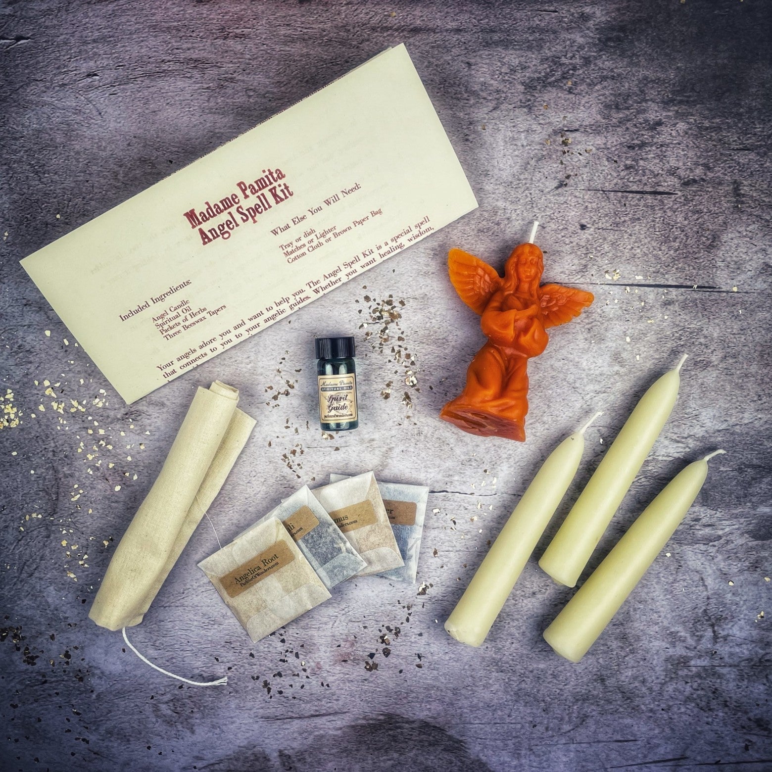 Red Angel Candle Spell Kit by Parlour of Wonders featuring candles and herbs for connecting with spirit guides and divine blessings.