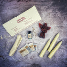 Parlour of Wonders Angel Candle Spell Kit with red candle and spiritual tools for connecting with spirit guides and divine blessings.