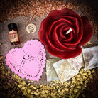 Parlour of Wonders Rose Romance Candle Spell Kit with yellow candles and love-themed accessories for romance and happiness.