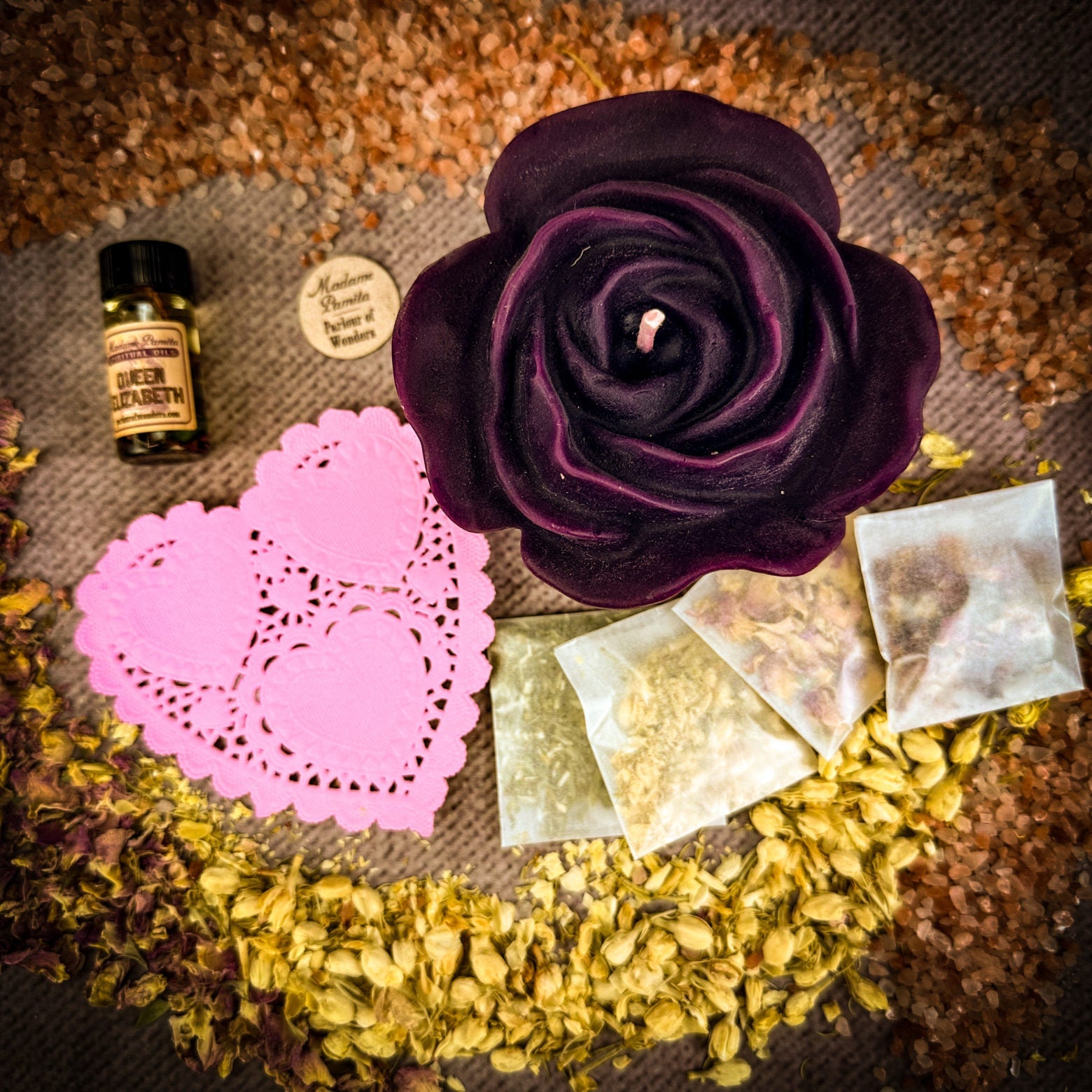 Parlour of Wonders Rose Romance Candle Spell Kit with yellow candles and love-themed elements for romance and happiness.