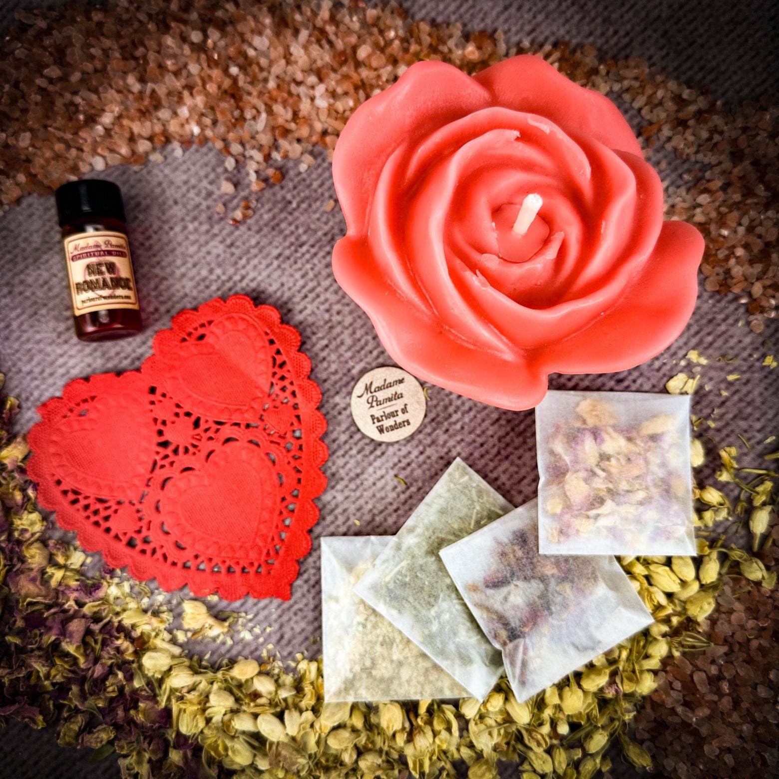 Parlour of Wonders Rose Romance Candle Spell Kit with yellow candles and love-themed accessories for romance and happiness.