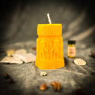 Anubis and Horus Egyptian Pillar Candle Spell Kit for protection and divine guidance, featuring yellow candles with Egyptian symbols.