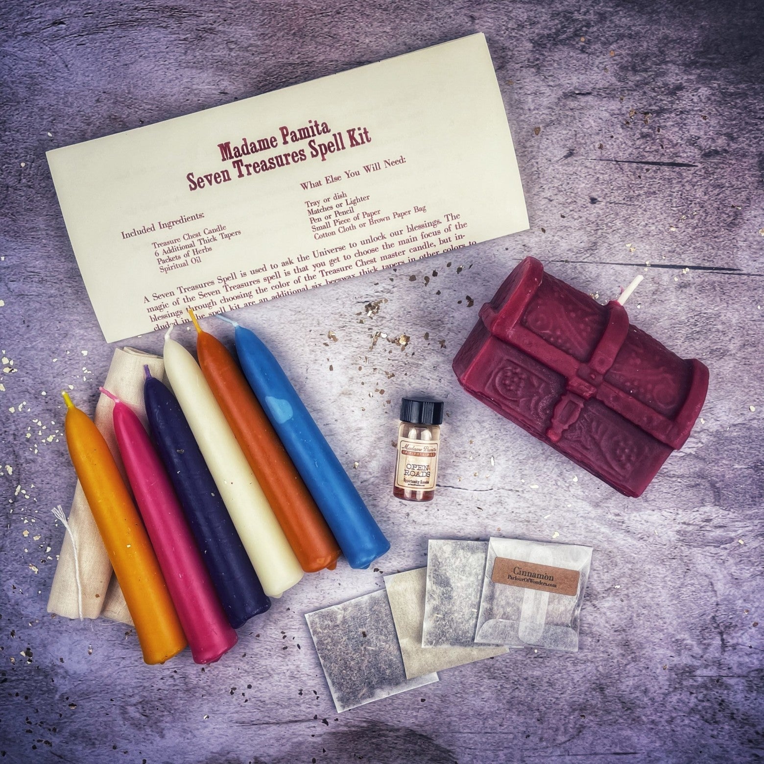 Parlour of Wonders Seven Treasures Candle Spell Kit with yellow candles for unlocking blessings and abundance.