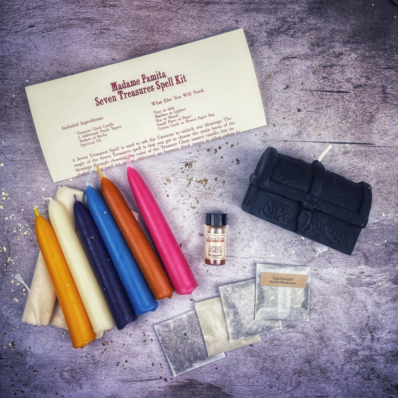 Parlour of Wonders Seven Treasures Candle Spell Kit with yellow candles for unlocking blessings and abundance.
