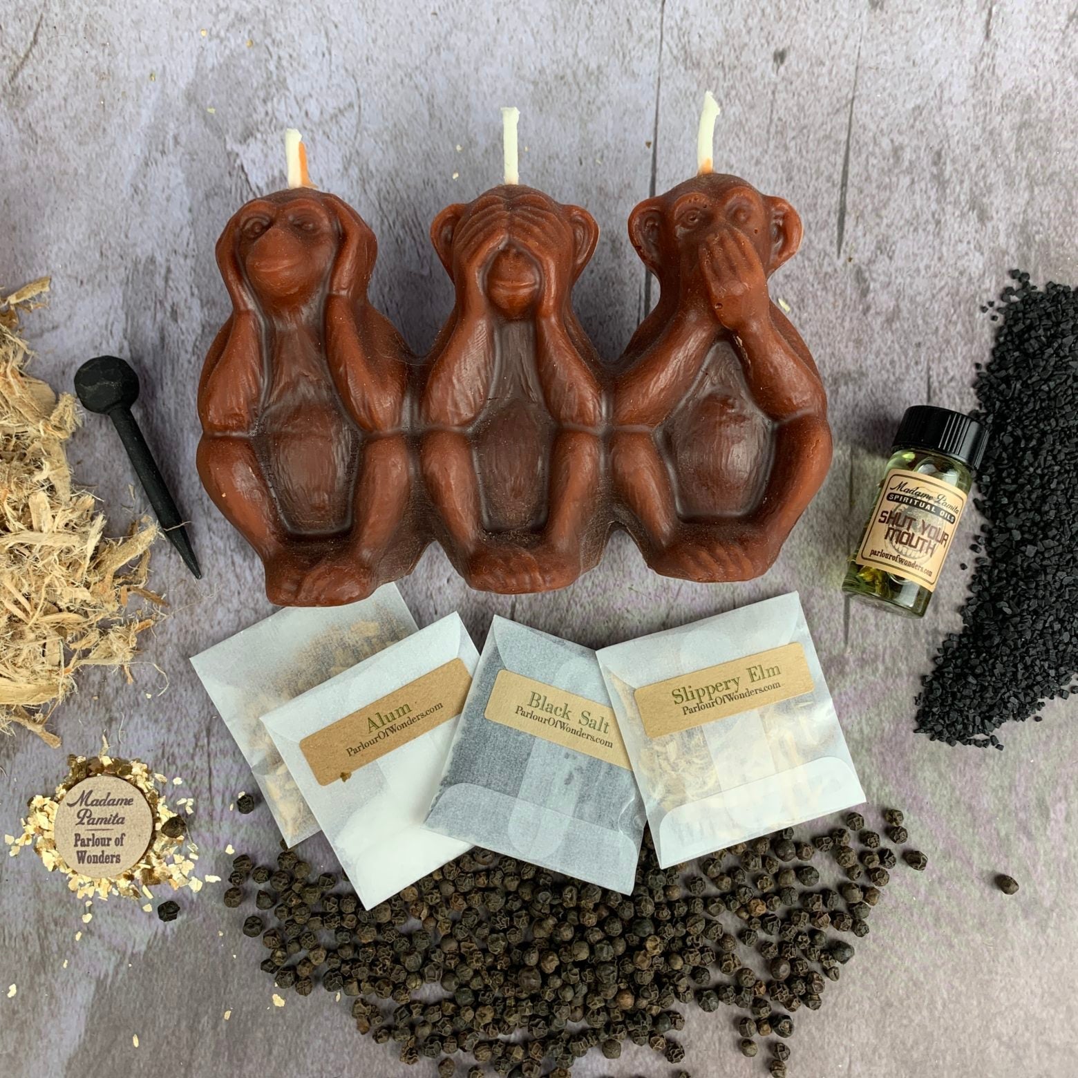 Parlour of Wonders candle spell kit for stopping gossip, silencing jealousy, and protecting reputation with a yellow success candle.