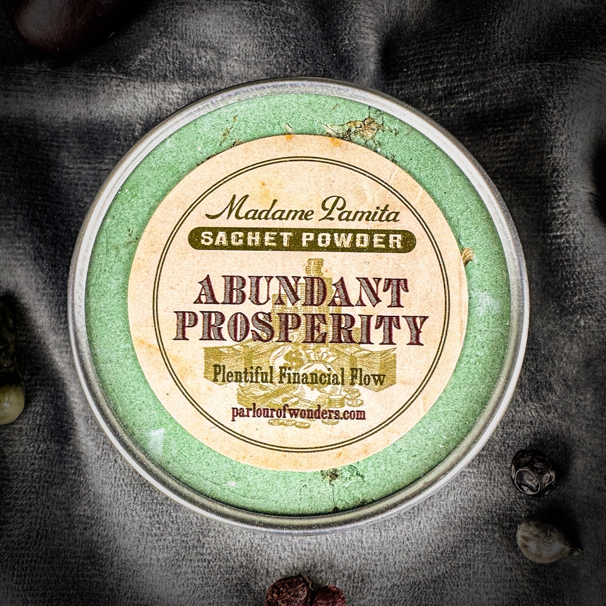 Abundant Prosperity Sachet Powder by Madame Pamita in a small packet, used for spiritual prosperity and abundance rituals.